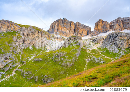 Sasso Pordoi ridge and cableway from Passo Pordoi 93883679
