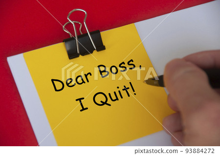 Dear boss, I quit text on yellow notepad on red cover background. Employment and resignation concept Dear boss, I quit text on yellow notepad on red cover background. Employment and resignation concept 93884272