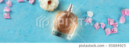 Rose perfume panorama. Floral fragrance bottle, overhead flat lay shot 93884925