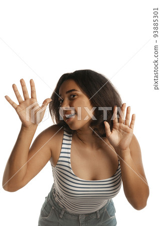 Young pretty girl, student leaned against transparent glass isolated on white color background. Close-up. Mental health, emotions concept Young pretty girl, student leaned against transparent glass isolated on white color background. Close-up. Mental health, emotions concept 93885301