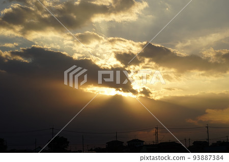 Clouds, golden light, sunset, beautiful evening scenery, light shining through the clouds 93887384