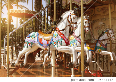 Close-up of carousel horses in sunset Close-up of carousel horses in sunset 93887452