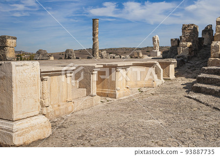 Roman ruins of Segobriga. Archaeological park. architectural facade of roman theatre. Spain 93887735