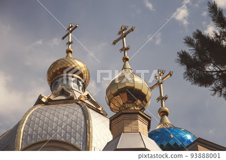 Golden domes of an Orthodox church with crosses Golden domes of an Orthodox church with crosses 93888001