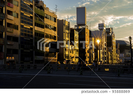 Osaka Minami, evening view from Dotonbori Bridge, building illuminated in golden color Osaka Minami, evening view from Dotonbori Bridge, building illuminated in golden color 93888869