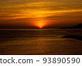 The sea and sky dyed red by the setting sun 93890590
