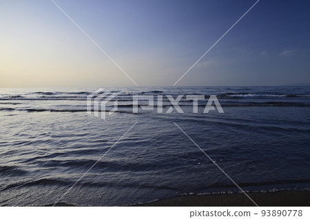 sunset and sandy sea 93890778