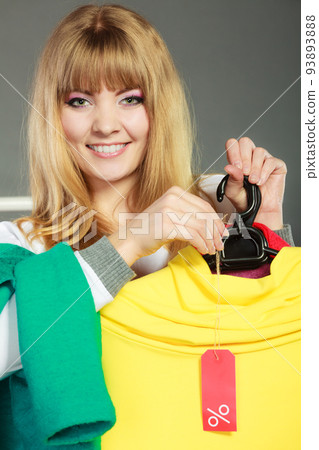 Woman holding discount label. Sale and retail. 93893888