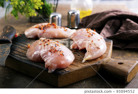 Raw chicken meat fillet on wooden background top view 93894552