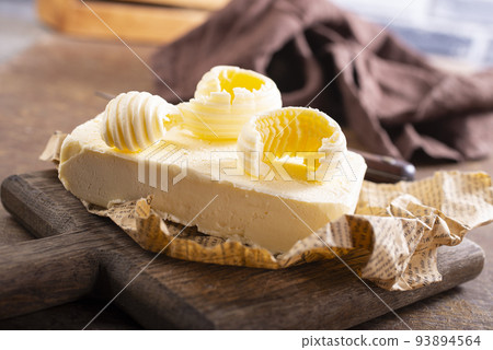 butter on paper, fresh butter and knife 93894564