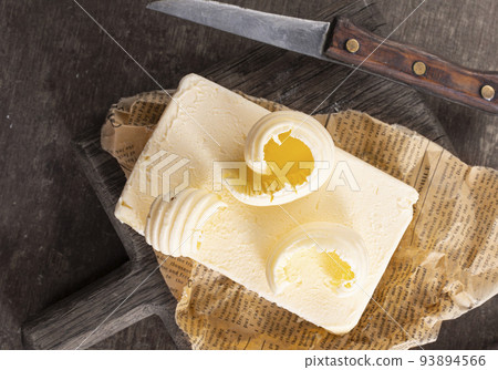 butter on paper, fresh butter and knife 93894566