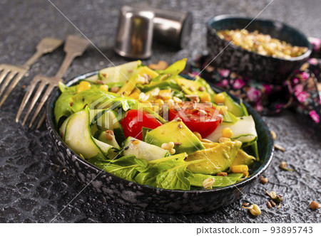 avocado, tomato and cucumber salad. Healthy vegan food. selective focus avocado, tomato and cucumber salad. Healthy vegan food. selective focus 93895743