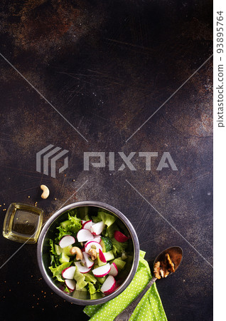 Spring salad with radishes and cucumbers Spring salad with radishes and cucumbers 93895764