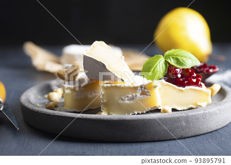 Camembert cheese with jam on gray plate 93895791