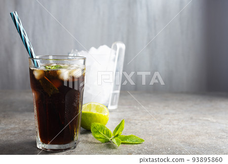 Cuba Libre or long island iced tea cocktail with strong drinks 93895860