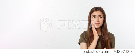 Teen woman pressing her bruised cheek with a painful expression as if she is having a terrible tooth ache 93897129