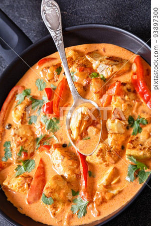 Fish Stew cooked with coconut milk and veggies Fish Stew cooked with coconut milk and veggies 93897300