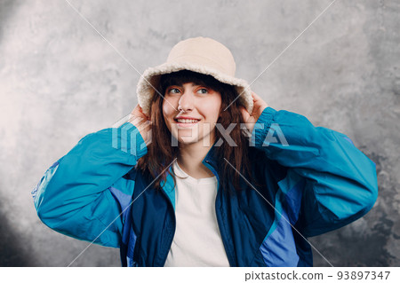 Young sporty woman 80 and 90's style. 90s fashion positive girl Young sporty woman 80 and 90's style. 90s fashion positive girl 93897347