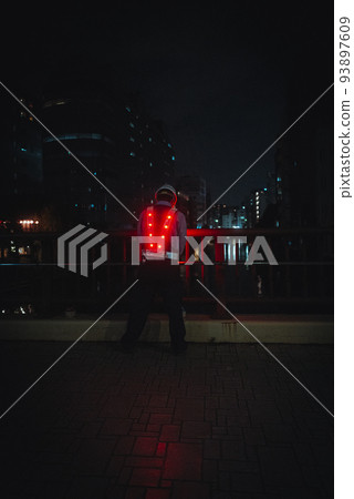 A man wearing a luminous vest and working late at night 93897609