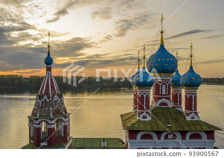 Uglich, Russia. Embankment of the Volga river in Uglich, the temple of Dmitry on Blood in the evening twilight, at sunset 93900567