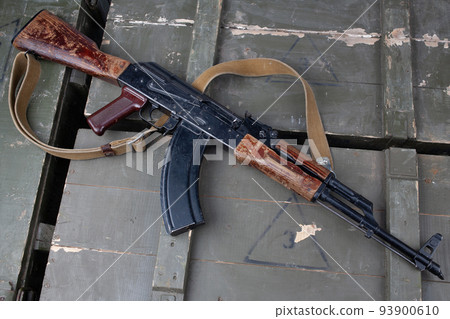 Kalashnikov AK47 gun on army green crate 93900610
