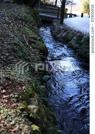 An image of a river flowing along the road An image of a river flowing along the road 93900956