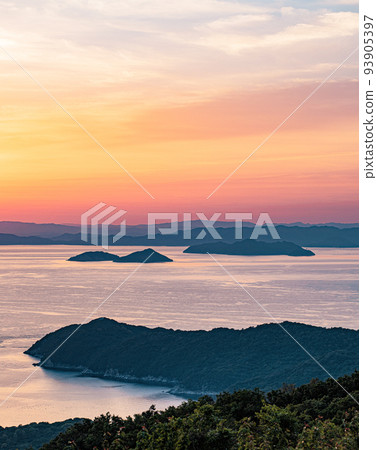 Seto Inland Sea with beautiful islands dyed in the setting sun 93905397