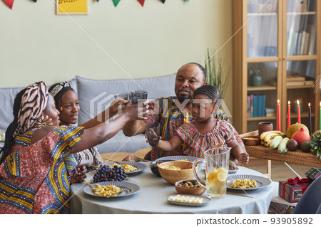 Family toasting with drinks celebrating holiday 93905892