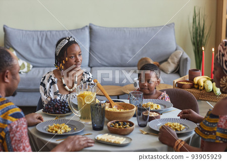 African family celebrating Kwanzaa at home 93905929