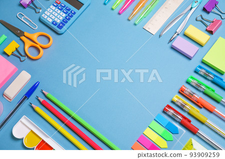 School objects, office supplies, tools and accessories isolated on blue School objects, office supplies, tools and accessories isolated on blue 93909259