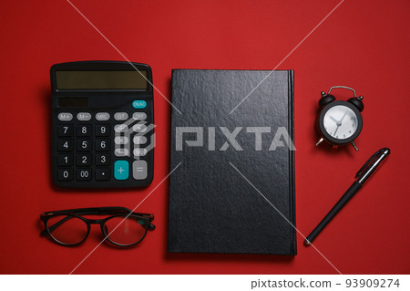 Male black notepad ballpoint pen and calculator, small alarm clock and glasses 93909274