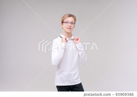 Shrugging caucasian boy, doubting shrugs, School boy, teenager with glasses Shrugging caucasian boy, doubting shrugs, School boy, teenager with glasses 93909386