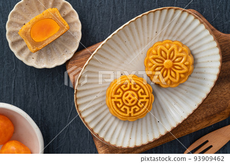 Delicious Cantonese moon cake for Mid-Autumn Festival food mooncake on blue table background. Delicious Cantonese moon cake for Mid-Autumn Festival food mooncake on blue table background. 93909462
