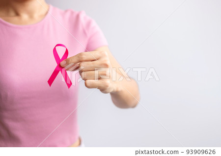 Pink October Breast Cancer Awareness month, woman hand hold pink Ribbon and wear shirt for support people life and illness. National cancer survivors month, Mother and World cancer day concept Pink October Breast Cancer Awareness month, woman hand hold pink Ribbon and wear shirt for support people life and illness. National cancer survivors month, Mother and World cancer day concept 93909626