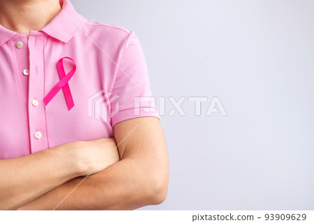Pink October Breast Cancer Awareness month, woman hand hold pink Ribbon and wear shirt for support people life and illness. National cancer survivors month, Mother and World cancer day concept Pink October Breast Cancer Awareness month, woman hand hold pink Ribbon and wear shirt for support people life and illness. National cancer survivors month, Mother and World cancer day concept 93909629