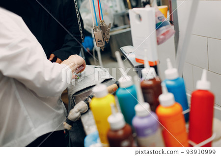 Dry cleaning clothes and removing dirty spot pollution. Clean cloth chemical process. Laundry industrial dry-cleaning. Stain remover 93910999