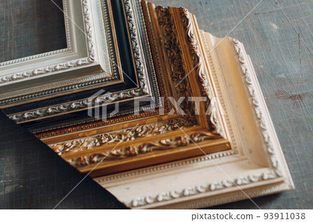 Framing Workshop. Different vintage baguette handmade picture frame at studio. Framing Workshop. Different vintage baguette handmade picture frame at studio. 93911038