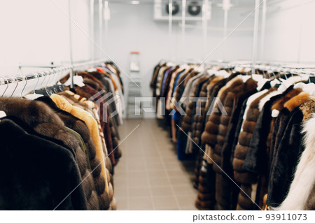 Dry cleaning clothes hanging fur coats. Clean cloth chemical process. Laundry industrial dry-cleaning. 93911073