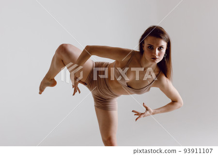 Young woman dancer dancing high heels dance Young woman dancer dancing high heels dance 93911107