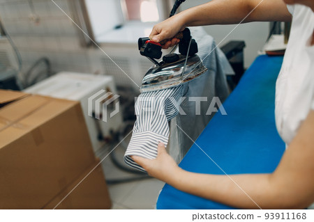 Dry cleaning ironing clothes. Clean cloth chemical process. Laundry industrial dry-cleaning. 93911168