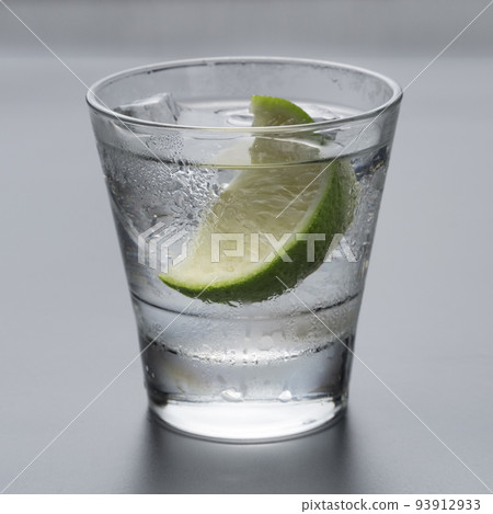 Vodka or gin with lemon in rocks glass Vodka or gin with lemon in rocks glass 93912933