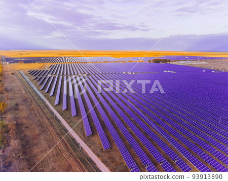 Aerial top view of a solar panels power plant. Photovoltaic solar panels at sunrise and sunset in countryside from above. Modern technology, climate care, earth saving, renewable energy concept. Aerial top view of a solar panels power plant. Photovoltaic solar panels at sunrise and sunset in countryside from above. Modern technology, climate care, earth saving, renewable energy concept. 93913890