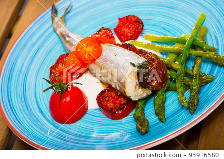 Baked whiting with sun-dried tomatoes, sparrowgrass, garlic creamy sauce 93916580
