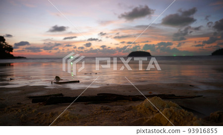 An epic sunset with a view of the sea and island 93916855