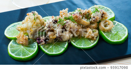 Battered calamari and cuttle with lime 93917098