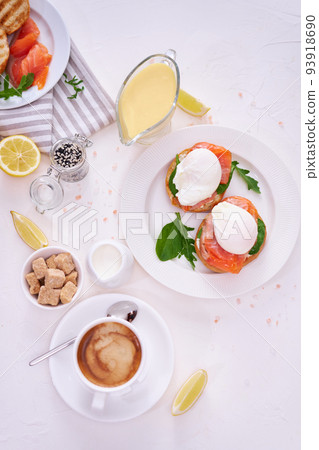 Cream cheese, Smoked salmon and poached egg toasts on a plate 93918690