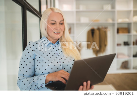 Pretty young self-employed woman workring from home Pretty young self-employed woman workring from home 93919201