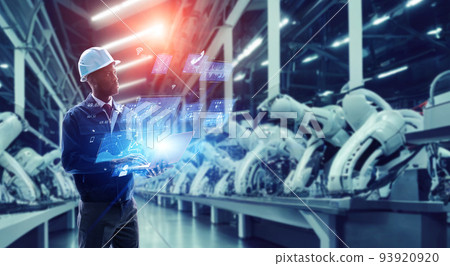 Male engineer operating a hologram screen in a factory 93920920