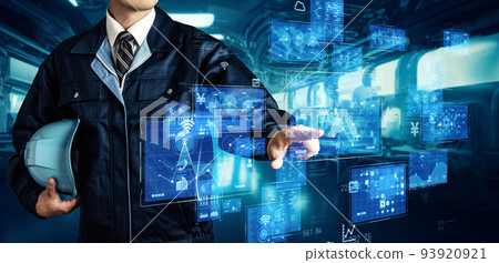 Male engineer operating a hologram screen in a factory 93920921