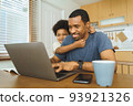African American boy being naughty his dad 93921326
